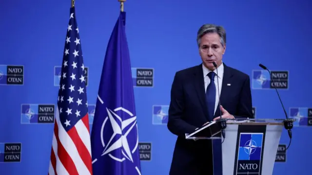 Blinken speals a press conference during a NATO foreign ministers meeting