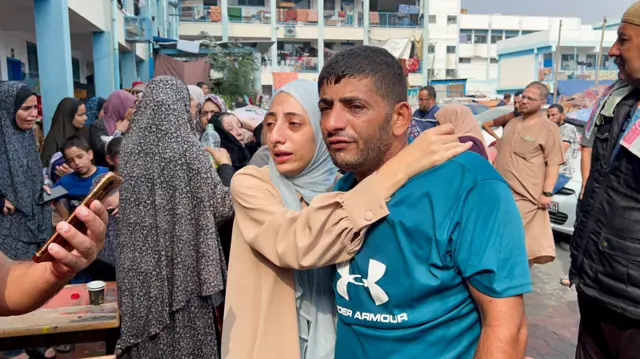 Palestinians react at the damages at a UN-run school sheltering displaced people, following an Israeli strike, in Jabalia in the northern Gaza Strip November 2, 2023.