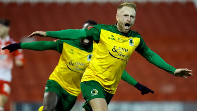 James Hammond runs with his arms out as he celebrates his goal