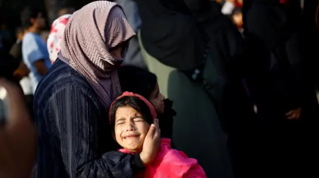 People mourn the Palestinians killed during Israeli strikes, amid the ongoing conflict between Israel and Palestinian Islamist group Hamas, at a hospital, in Khan Younis in the southern Gaza Strip, November 3, 2023