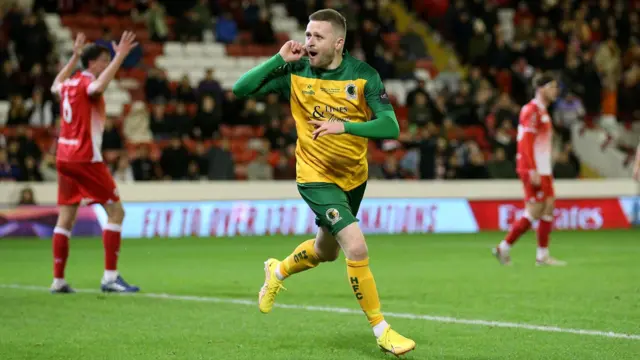 Tom Richards puts his hand to his ear as he celebrates his equaliser for Horsham