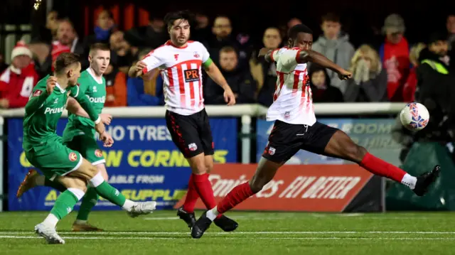 Tom Knowles (left) strikes to score for Walsall