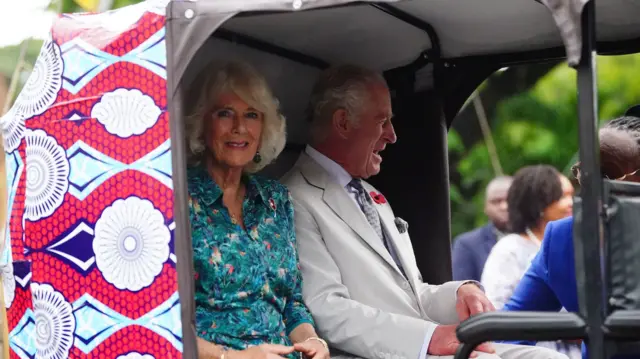 In Kenya, King Charles and Queen Camilla pose for the press in a tuk-tuk