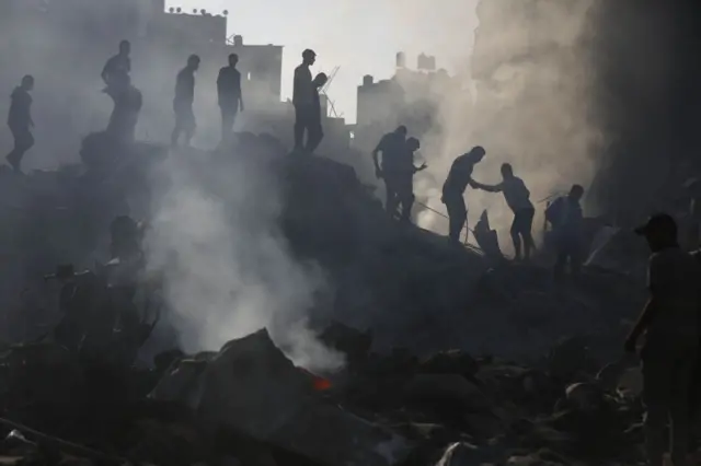 Civilians try to reach survivors, dead bodies amid destruction caused by Israeli strikes on Bureij refugee camp located in central Gaza Strip on November 02, 2023.