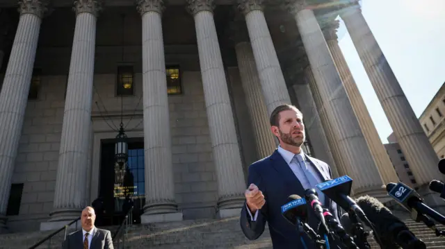 Eric Trump speaks outside a NYC court