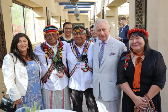 Director of Global Strategy Amazon Sacred Headwaters Atossa Soltani, President the Amazon Sacred Headwaters Domingo Peas, The Baroness Scotland of Asthal Patricia Scotland, representative of COICA Juan Carlos Jintiach, King Charles III and Joênia Wapixana pose at the Commonwealth and Nature reception during COP28