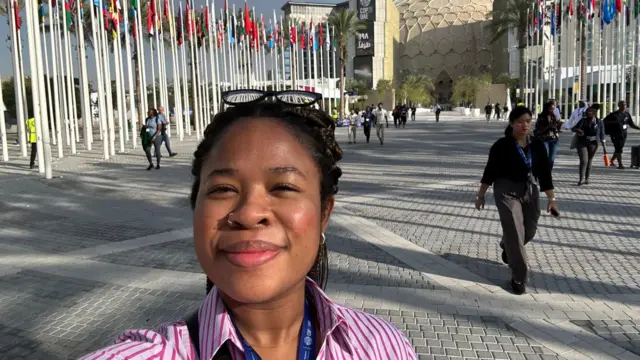 BBC reporter Malu Cursino in Dubai walking to COP28 opening conference