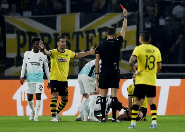 AEK Athens' Mijat Gacinovic is shown a red card