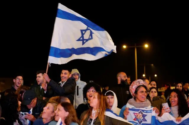 People in Israel react after the release of hostages held in Gaza