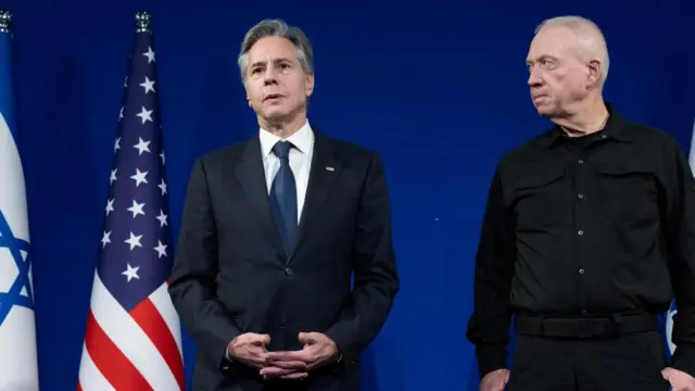 Israeli Defence Minister Yoav Gallant looks at US Secretary of State Antony Blinken