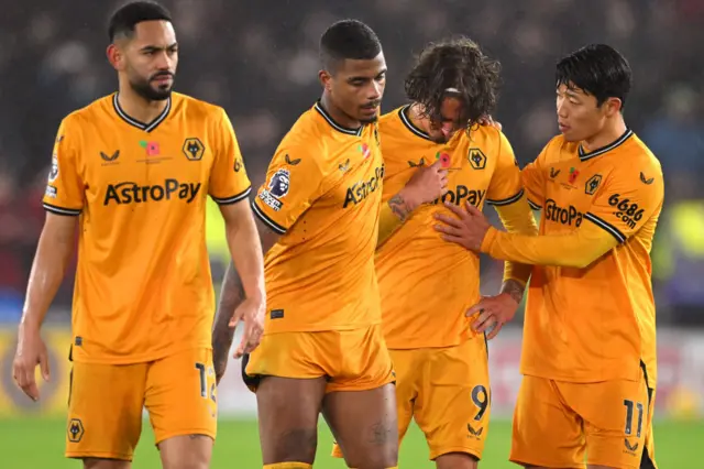 Fabio Silva is consoled by his Wolves team-mates