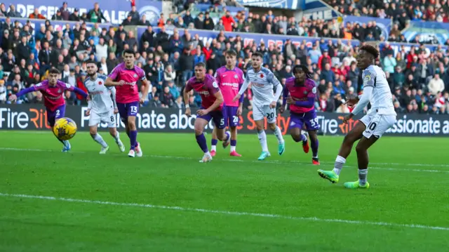 Jamal Lowe (right) strikes a penalty