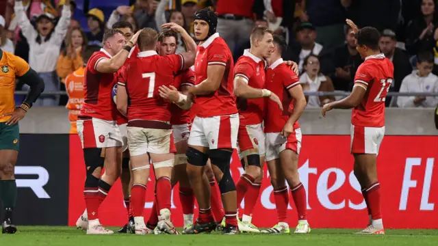 Wales celebrate a record win over Australia at the World Cup