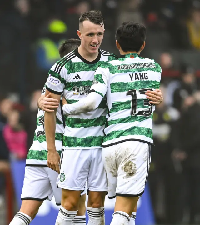 David Turnbull and his Celtic team-mates celebrate his opening goal against Ross County