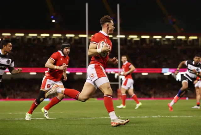 Wales's Tom Rogers scores a try