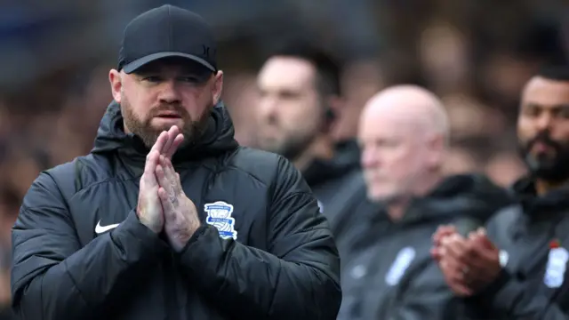 Wayne Rooney puts his hands together on the touchline