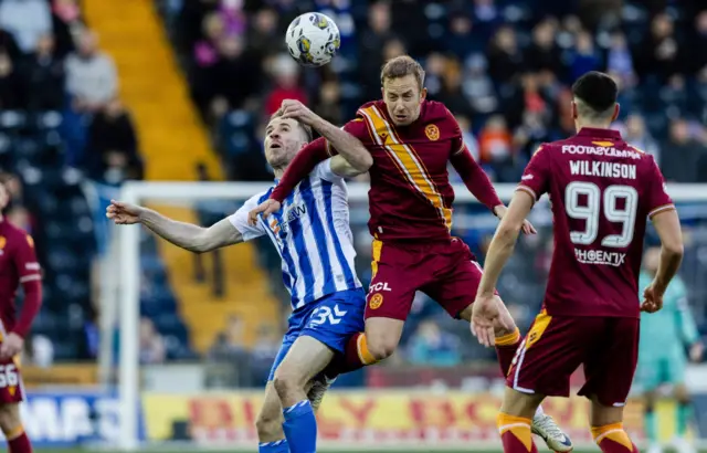 Kilmarnock's Marley Watkins and Motherwell's Harry Paton and Conor Wilkinson