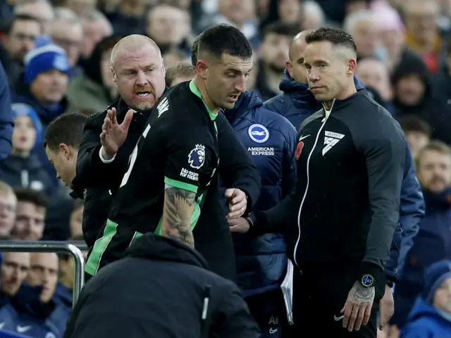 Lewis Dunk speaks to the officials