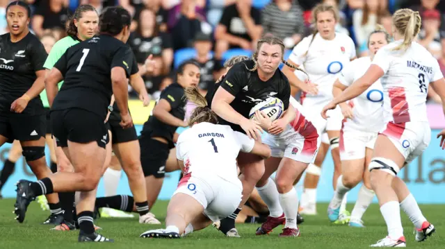 New Zealand carry the ball against England