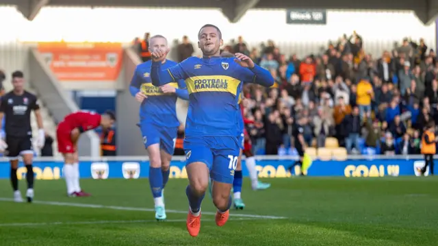 Ali Al Hamadi celebrates scoring for AFC Wimbledon