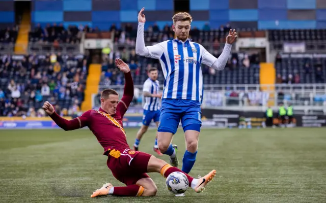 Motherwell's Dan Casey challenges Kilmarnock's Stuart Findlay