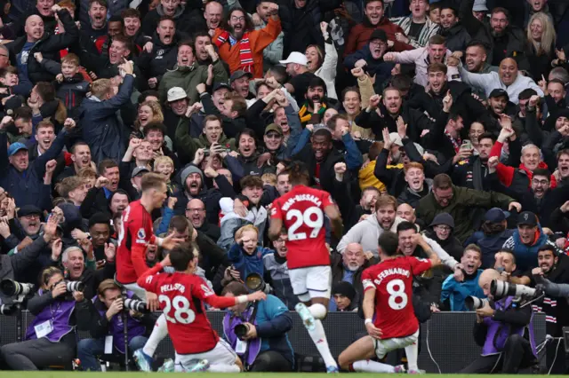 Bruno Fernandes celebrates in front of the Manchester United fans