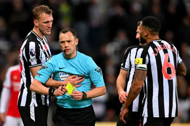 Dan Burn holds in to referee Stuart Atwell