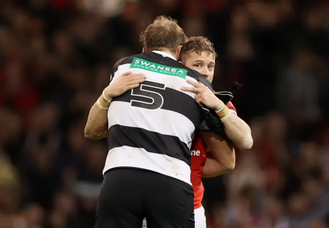 Alun Wyn Jones embraces Leigh Halfpenny