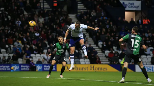 Milutin Osmajić jumps to head the ball into the net and score