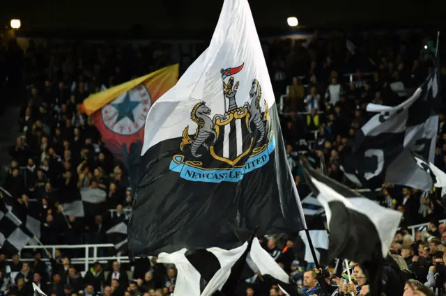 A newcastle flag being flown at the Gallowgate end before kick off.