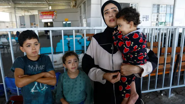 A family waiting at Rafah border crossing today