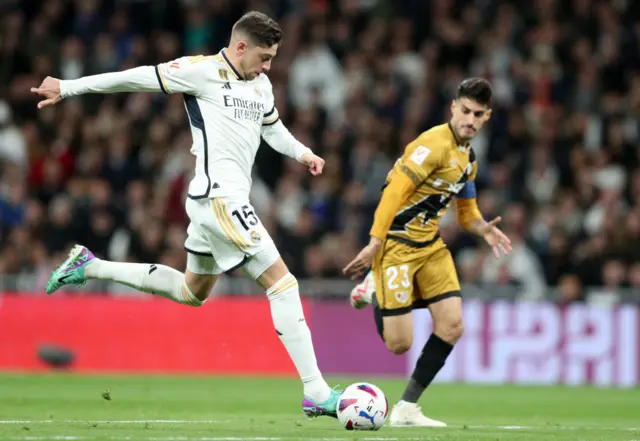 Federico Valverde of Real Madrid runs with the ball