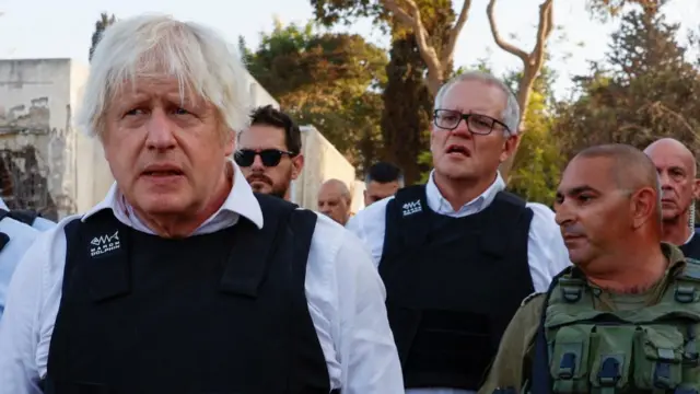 Boris Johnson and Scott Morrison visit Kibbutz Kfar Aza, which was attacked on 7 October