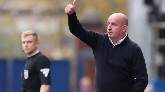 Portsmouth boss Andy Cook puts his thumb up