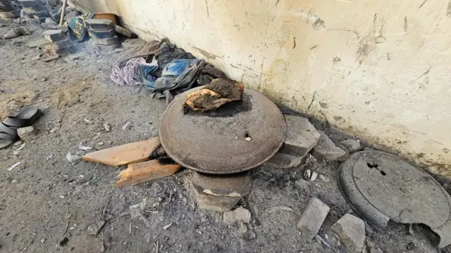 Burnt food lies near other damaged belongings at a UN-run school in Jabalia refugee camp