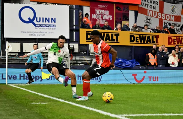 Trent Alexander-Arnold of Liverpool competing with Chiedozie Ogbene