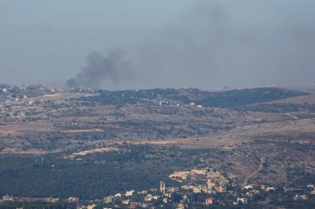 Smoke rises above Lebanon, as seen from northern Israel, earlier today