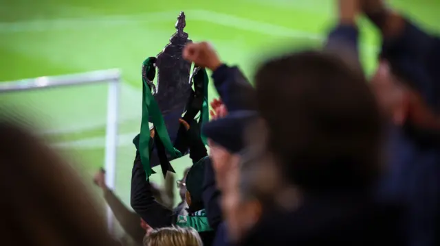 Cray Valley fans hold a tin foil FA Cup