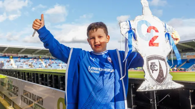 Chesterfield fan holds trophy