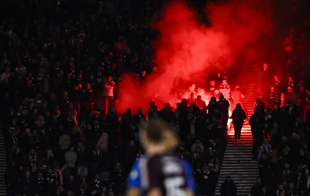 Hearts fans light a flare at Hampden