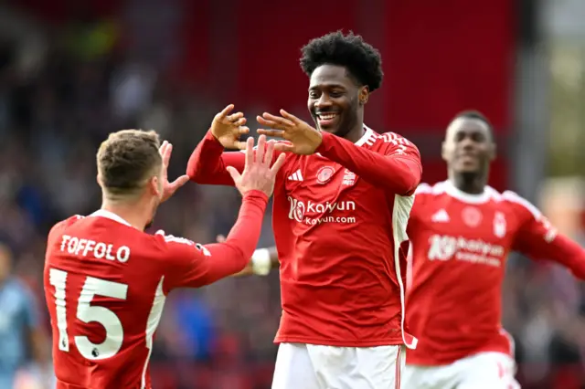 Ola Aina of Nottingham Forest celebrates with Harry Toffolo