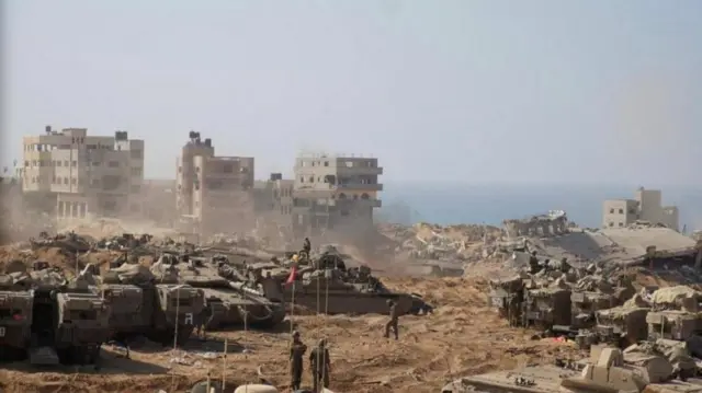 Israeli soldiers and tanks take position inside the Gaza Strip, according to the Israeli Defense Forces (IDF), in this handout picture obtained by Reuters on November 5, 2023