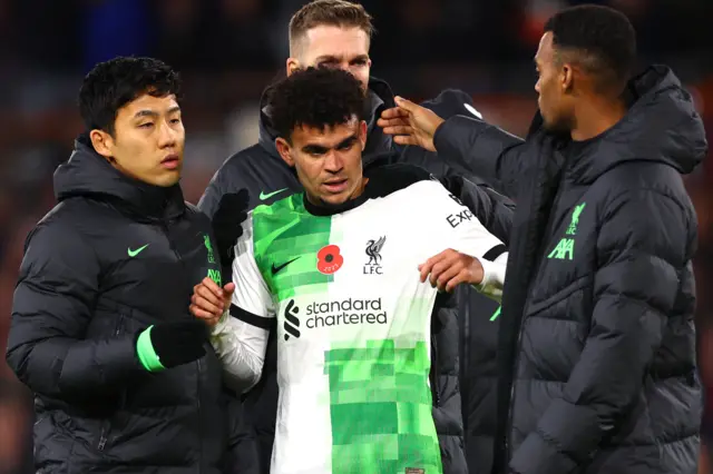 Luis Diaz surrounded by Liverpool teammates