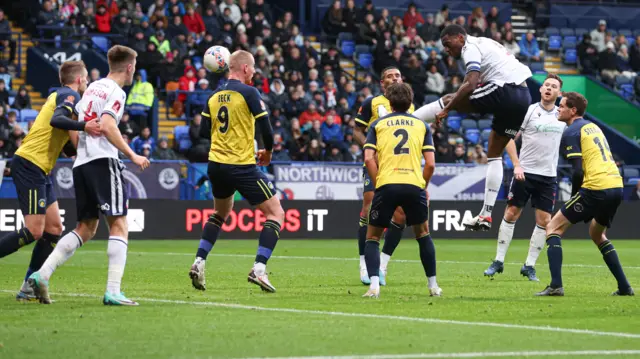 Ricardo Santos heads home for Bolton against Solihull Moors