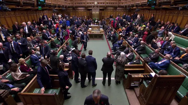 Aerial shot of Commons as some MPs stand to leave