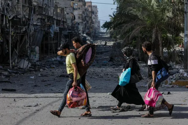 People leaving Gaza City, in the north of the strip, on Monday