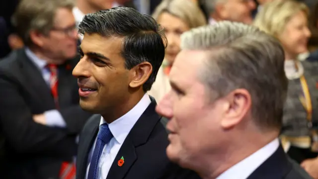 Prime Minister Rishi Sunak (left) and Labour Party leader Sir Keir Starmer walk through the Members' Lobby at the Palace of Westminster ahead of the State Opening of Parliament in the House of Lords, London. Picture date: Tuesday November 7, 2023. PA Photo. King Charles III is delivering his first King's speech as monarch, having previously deputised for the late Queen to open parliamentary sessions. See PA story POLITICS Speech.