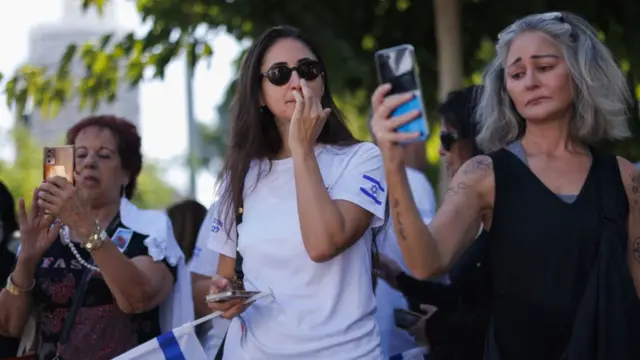 Members of the public gather in Dizengoff square to observe a silence and vigil to mark the one month anniversary of the attacks, on November 07, 2023 in Tel Aviv, Israel.