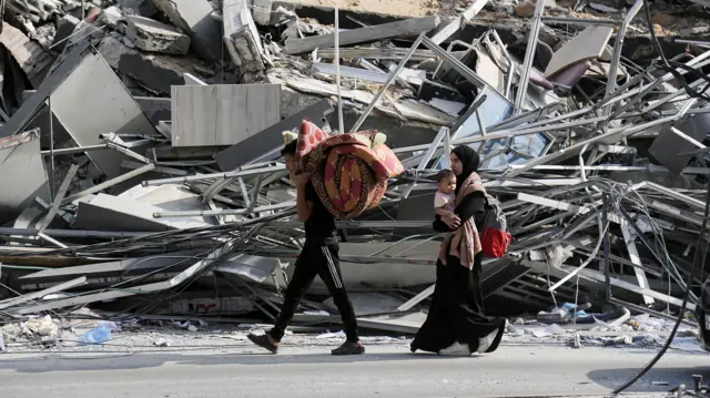 Residents of Gaza City have a few belongings gathered as they begin to evacuate following an Israeli warning of increased military operations in the Gaza strip,