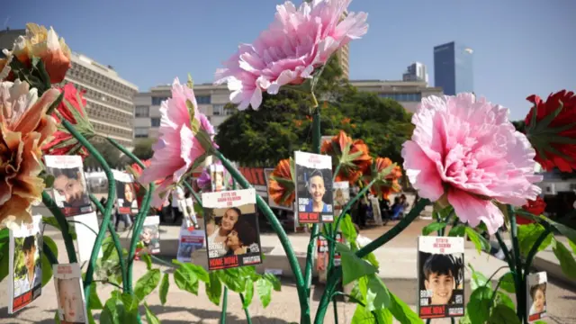 Members of the public gather in Dizengoff square to observe a silence and vigil to mark the one month anniversary of the attacks, on November 07, 2023 in Tel Aviv, Israel.